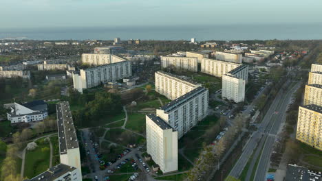 aerial view captures a cityscape with large apartment blocks neatly arranged in rows