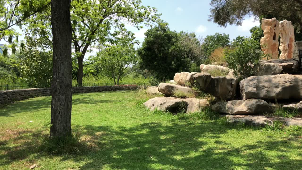 In the park wall stone and trees