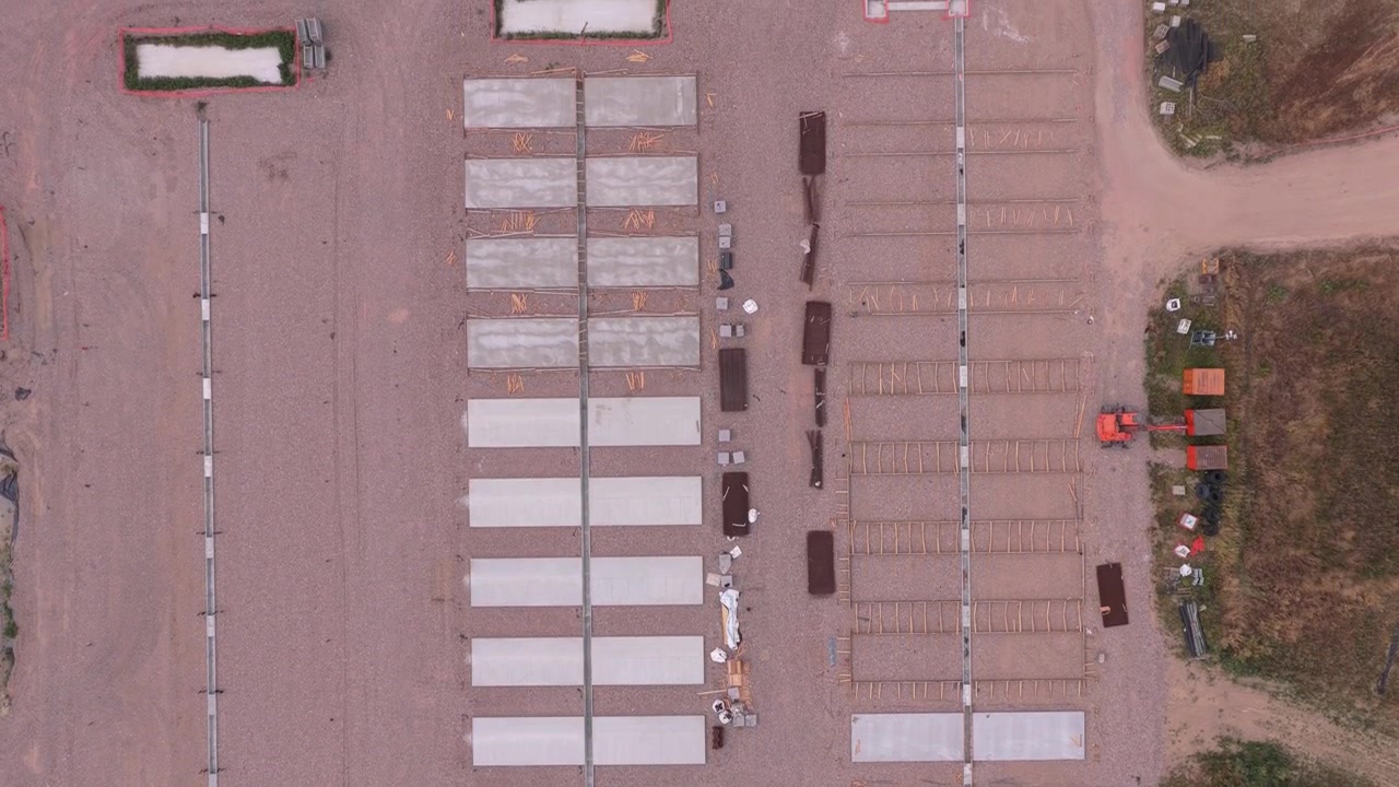 Aerial View of Construction Site with Concrete Foundation Slabs