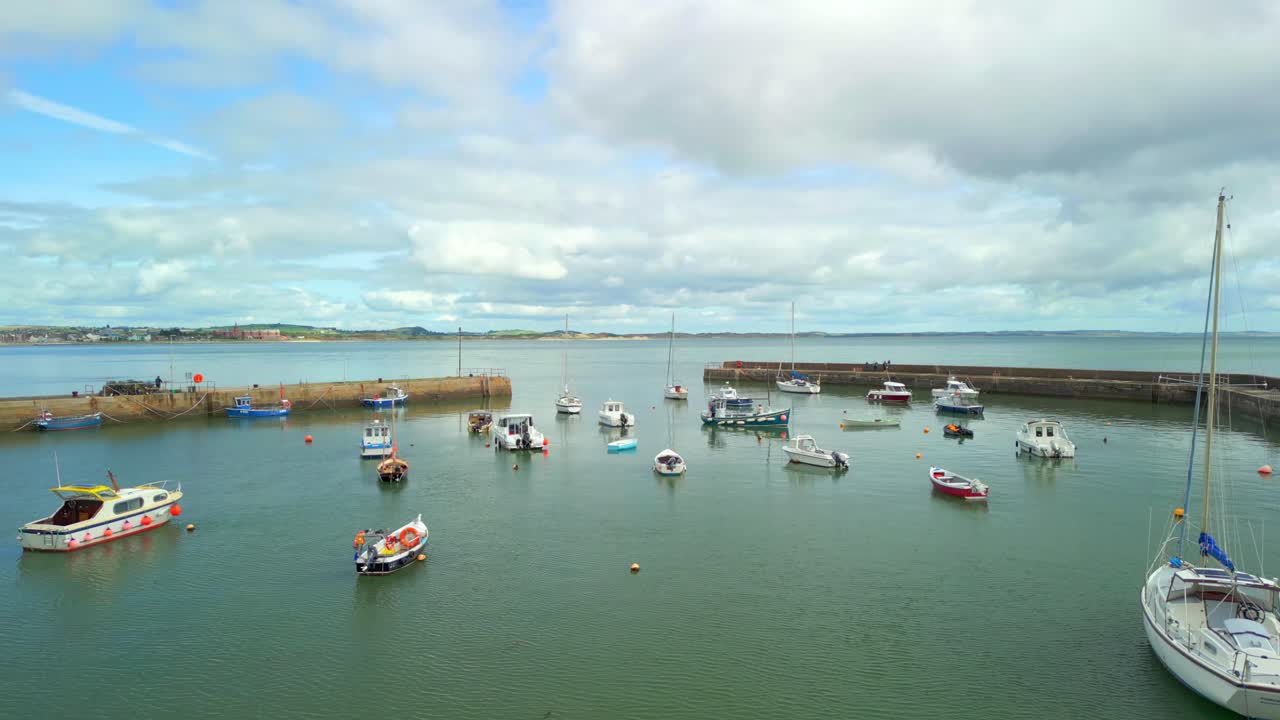 Reversing aerial video of Newcastle Harbour in County Down, Northern Ireland. Filmed in 4K, 60FPS and with Rec709 color