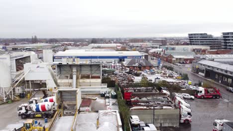 Industrial-CEMEX-concrete-manufacturing-factory-yard-aerial-view-with-trucks-parked-around-materials