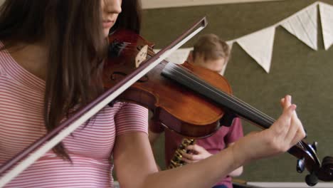 teenage musicians rehearsing