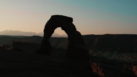 silhouette of the delicate arch in arches national park in utah.