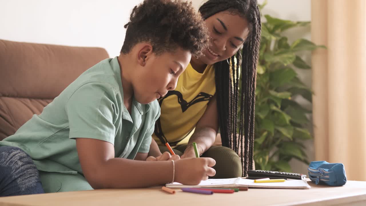 Mother and child drawing together at home