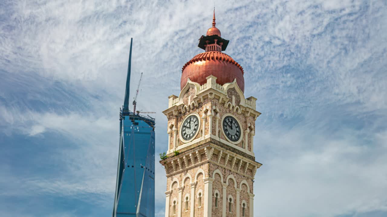 The clock tower of Sultan Abdul Samad Building and the new  PNB118