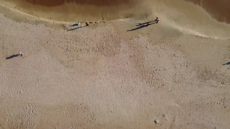 river running parrallel to beach drone view from the top