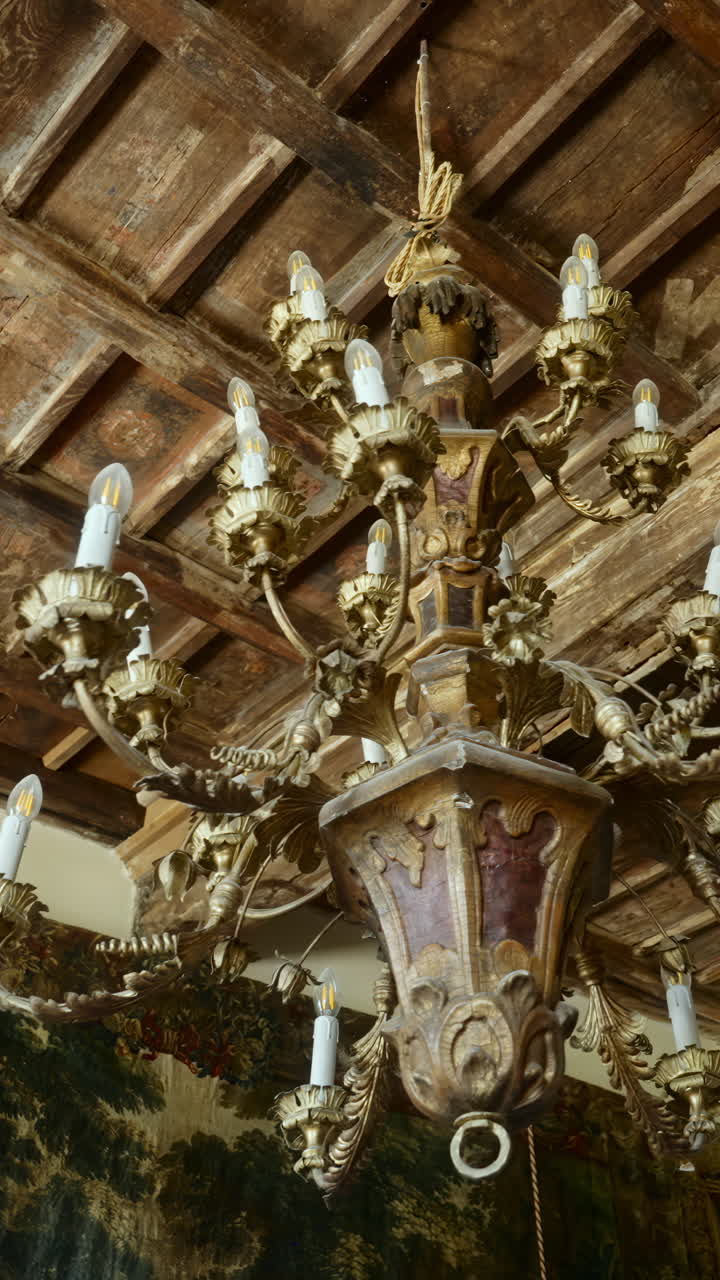 Ornate Chandelier in a Room with Wooden Ceiling