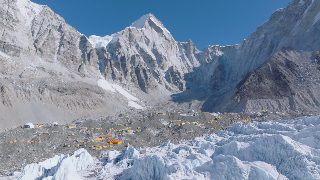 Aerial view of Everest Base Camp with white Khumbu glaciers, snow peaks and water towers, clear blue sky, and visible global warming impact, karakoram anamoly process in nepali tourism