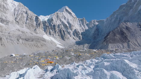 aerial view of everest base camp with white khumbu glaciers, snow peaks and water towers, clear blue sky, and visible global warming impact, karakoram anamoly process in nepali tourism