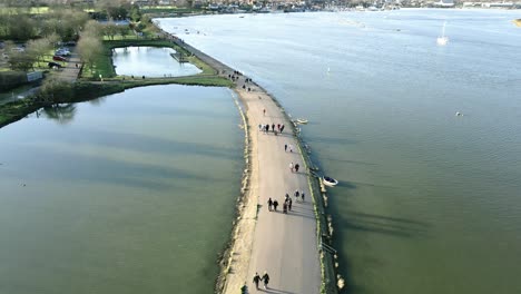 Aerial-Drone-View-Of-Maldon-Promenade-With-Tourists-Sightseeing-At-Statue-of-Byrhtnoth-In-Essex,-UK