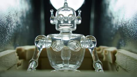 a stunning look at a crystal clear glass robot figurine: capturing the intricacies of design and artistry in a captivating display setting