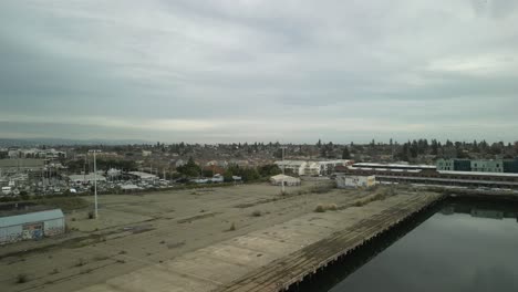 a serene aerial shot of mariner square in alameda, showcasing its nautical lifestyle against the backdrop of california's blue skies.