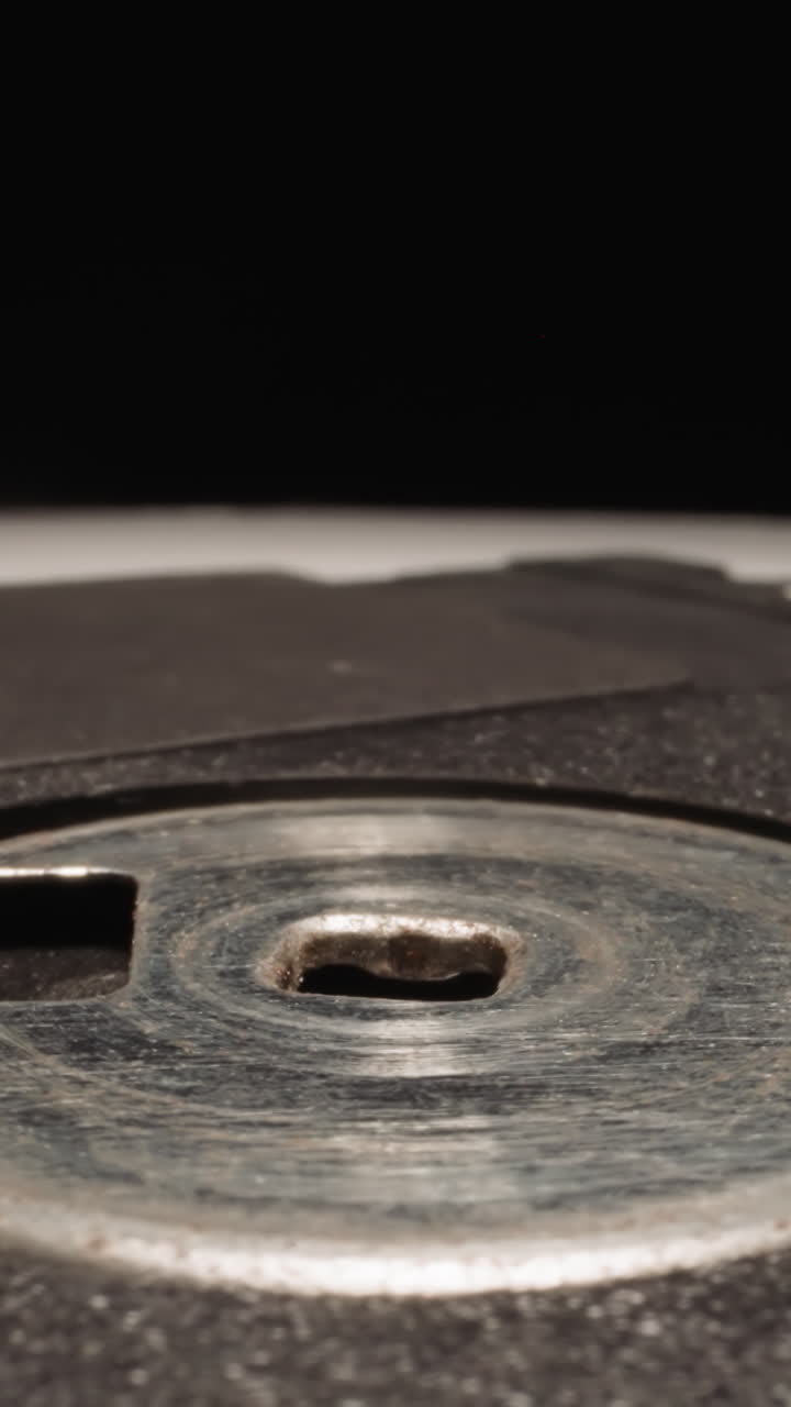 Floppy disk designed to watch eclipses on black background. Modern electronic storage device created for recording and transferring data macro