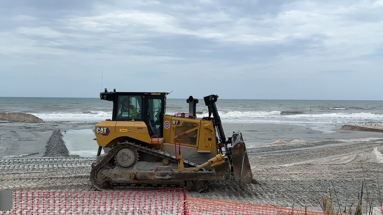 Bulldozer Working on Beach near Ocean