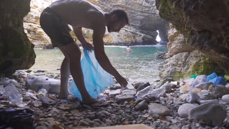 nature lover man who collects garbage thrown into nature.