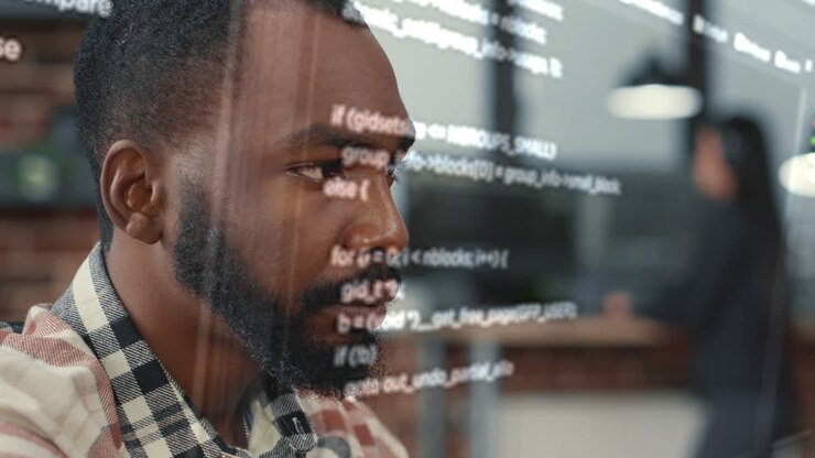 Portrait of african american software developer through vfx of floating programming code working focused