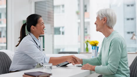 doctor handshake, senior woman