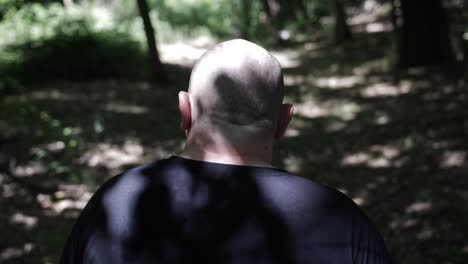 A-man-walking-through-forest-trees