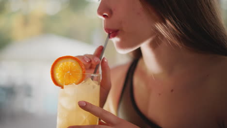 woman enjoying a refreshing cocktail