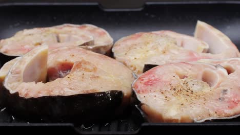 cooking fish steaks in a pan