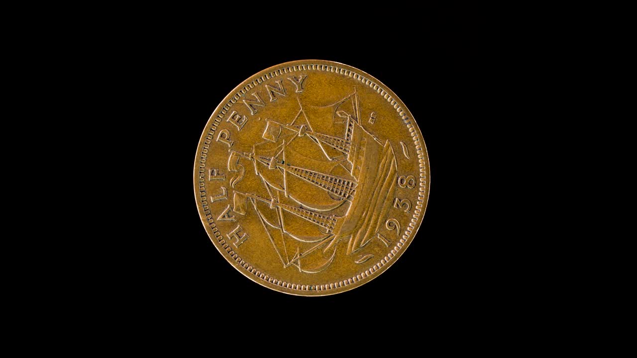 1938 UK half penny rotates to show reverse ship design on a black background