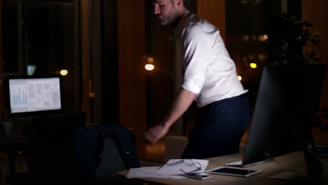 mature businessman leaving his office at night