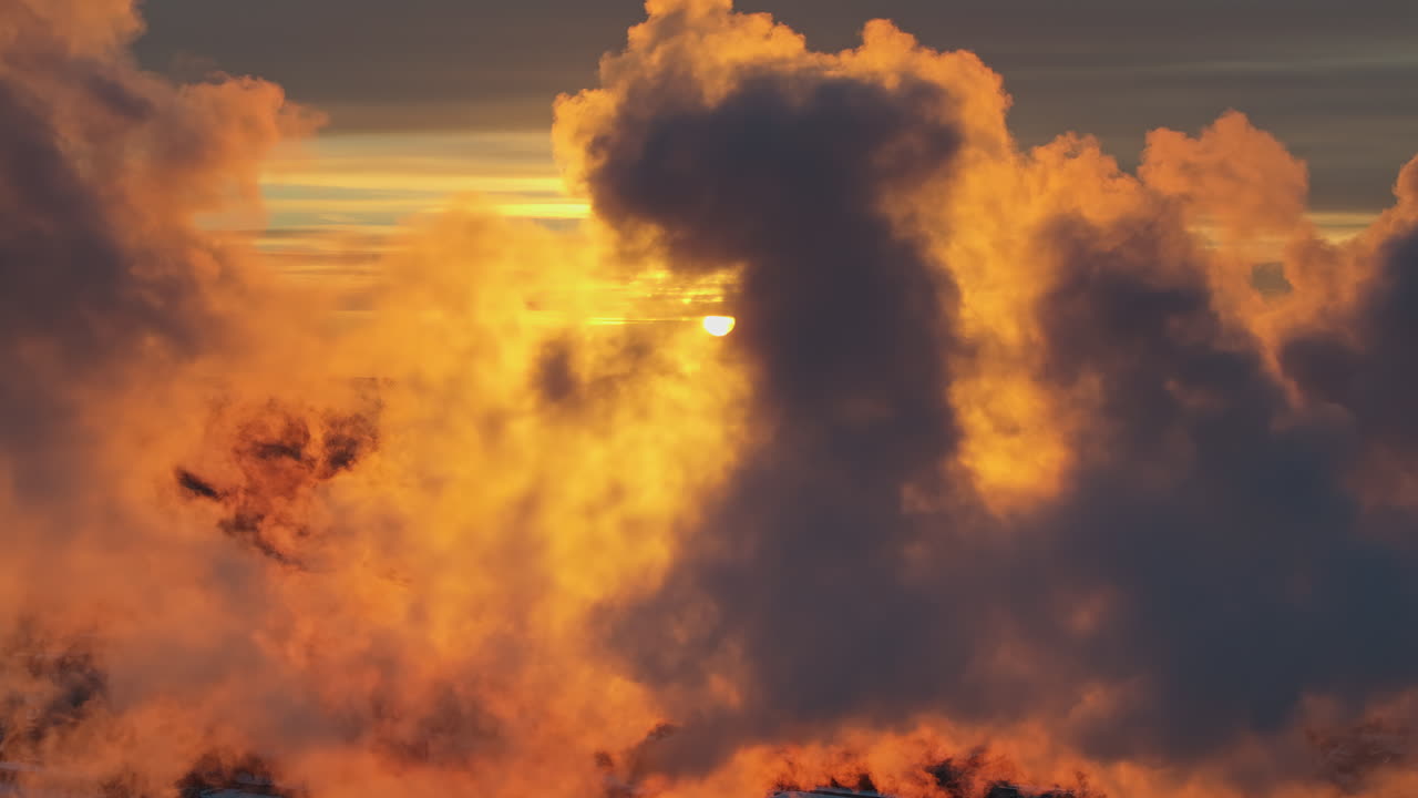 Aerial drone view of Chisinau city covered in snow at sunset. Passing through the smoke. Winter in Moldova