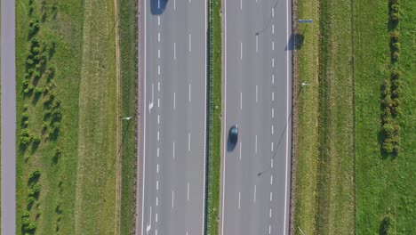 highway with vehicles flowing in opposite directions - overhead drone