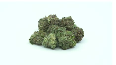 cannabis nuggets rotating, isolated on a white background