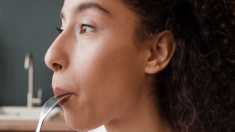close-up of a young woman eating a healthy salad