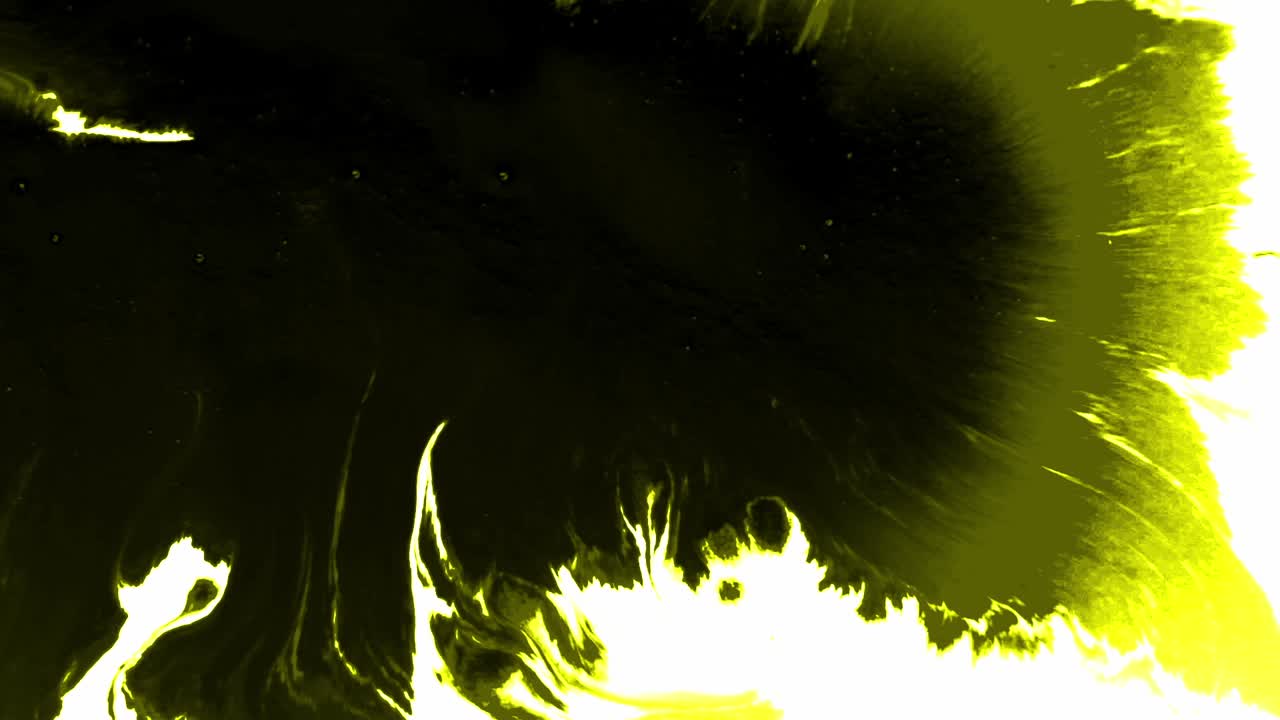 Splashes and spots of yellow ink spreading on white background