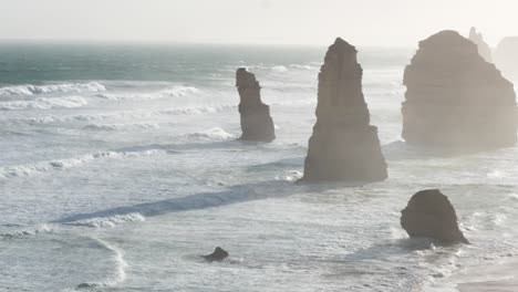 a serene view of the twelve apostles rock formations along the great ocean road, captured in soft morning light and gentle waves