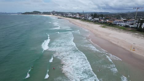 drone flying over lifesavers in palm beach - gold coast - queensland qld - australia - drone shot