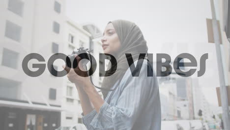 animation of text vibes over woman taking photo