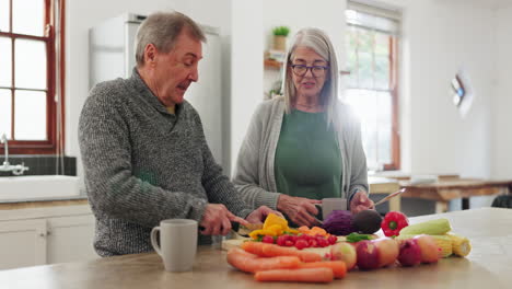 Old-couple-in-kitchen,-cooking-together