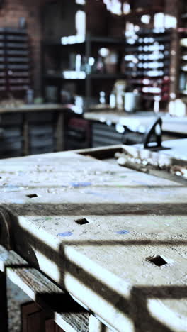 closeup of a weathered workbench in a workshop