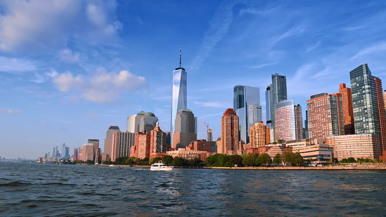 Beautiful high-rises and skyscrapers at the river waterfront. Low angle view at New York architecture from the waterscape