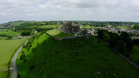 aerial view of ireland's rock of cashel perched on a hill side.
