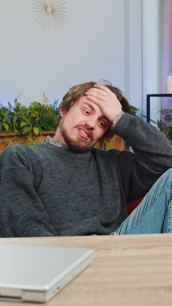 Sad bearded man use smartphone surprised by bad news fortune loss fail lottery results deadline