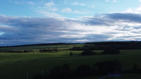field green grass pasture mountains in the evening circled alberta canada