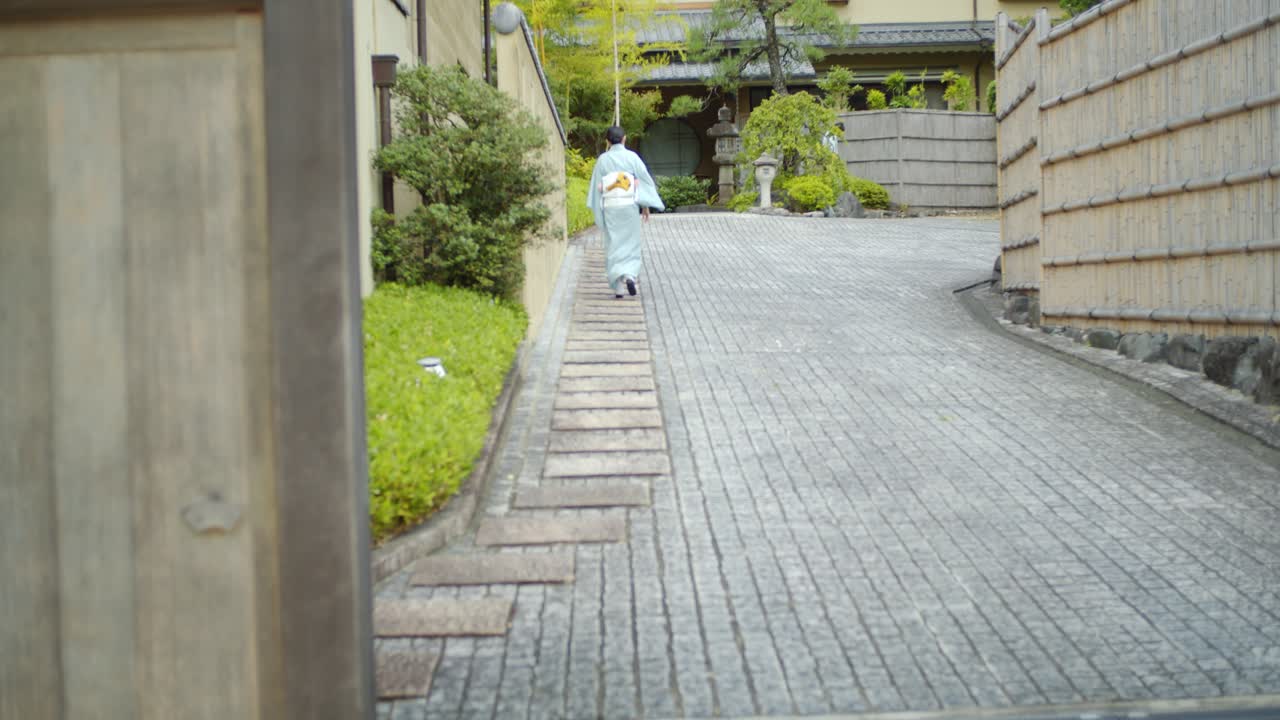 Beautiful girl walking in a traditional kimono in Kyoto, Japan soft lighting slpw motion 4K