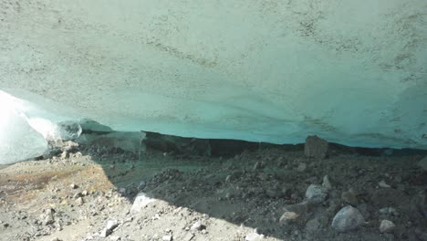 close up view of ice melting from blue glacier, climate change concept