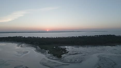 aerial-view-of-orange-Sunrise-in-slow-motion-near-Setubal,-Portugal