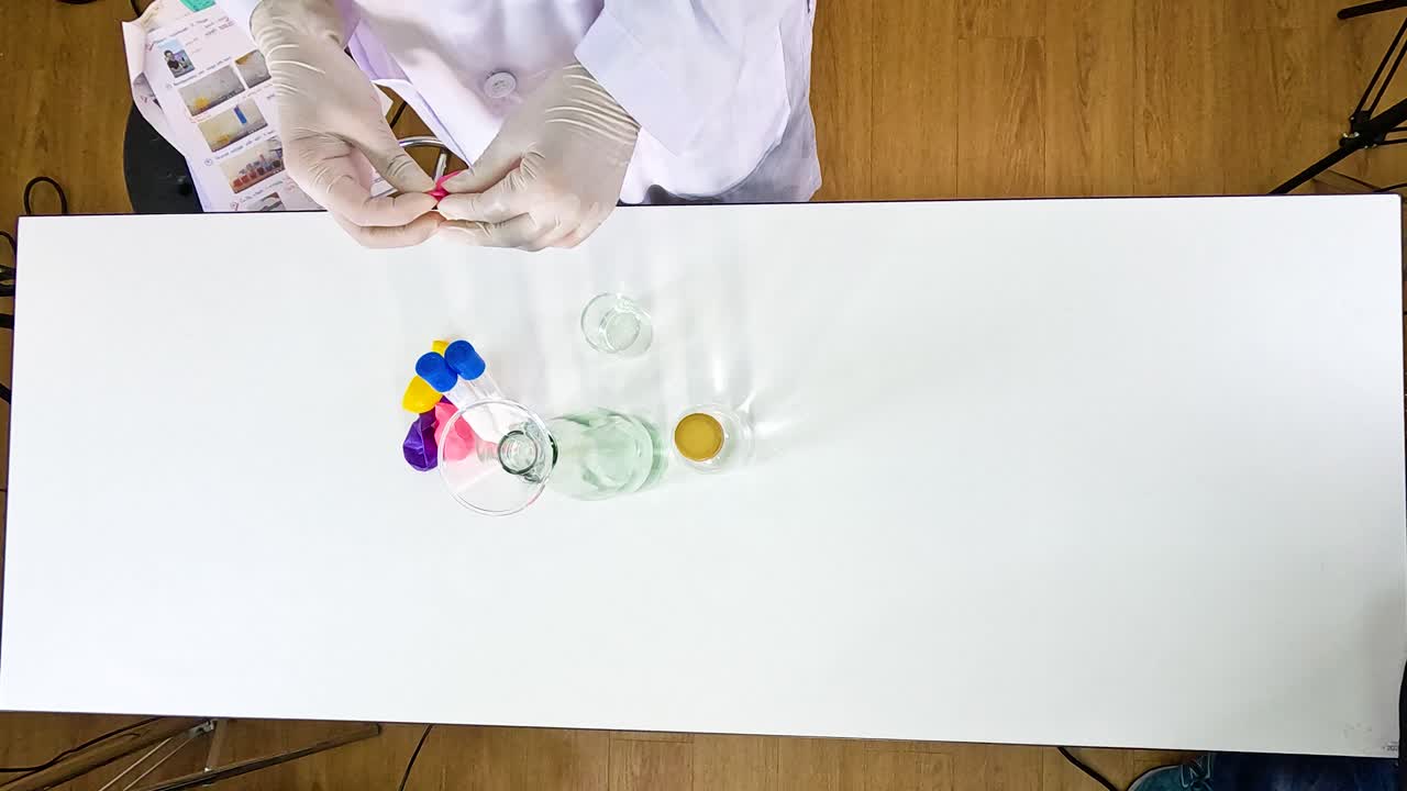 A step-by-step science experiment inflating balloons using sodium bicarbonate and vinegar, captured in a well-lit, overhead view