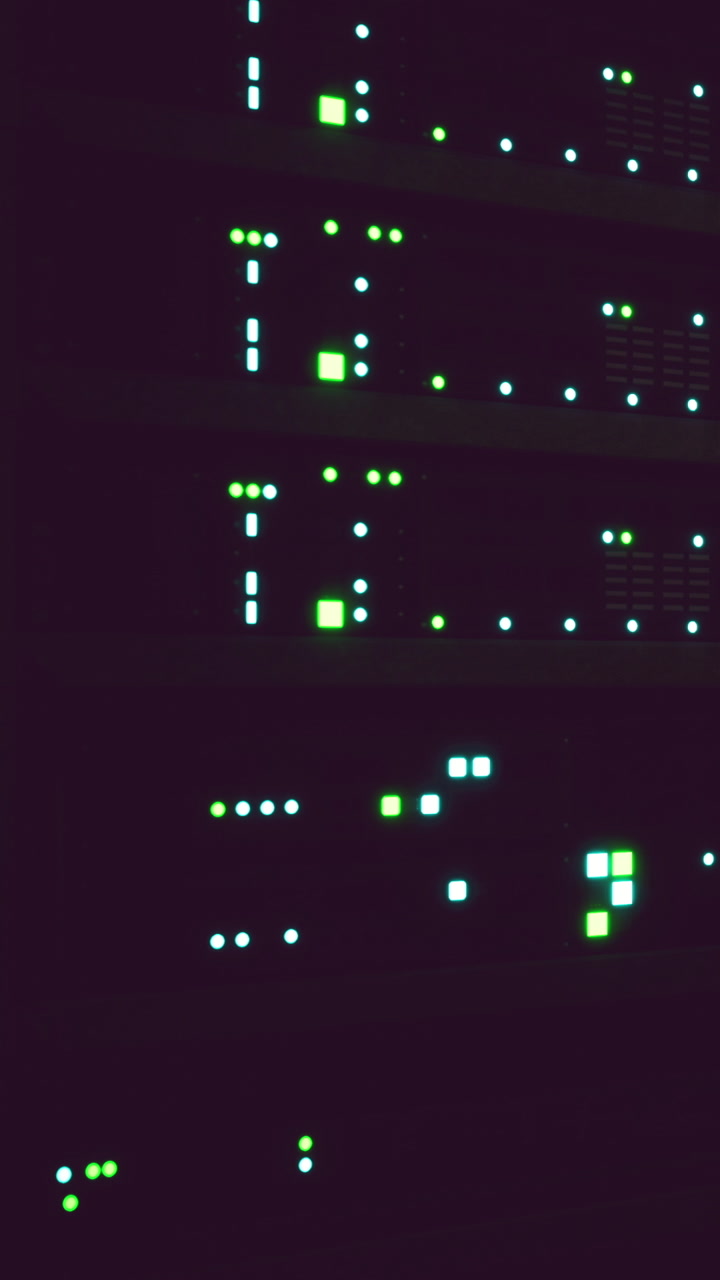 Network servers glow brightly in a dark data center during late hours