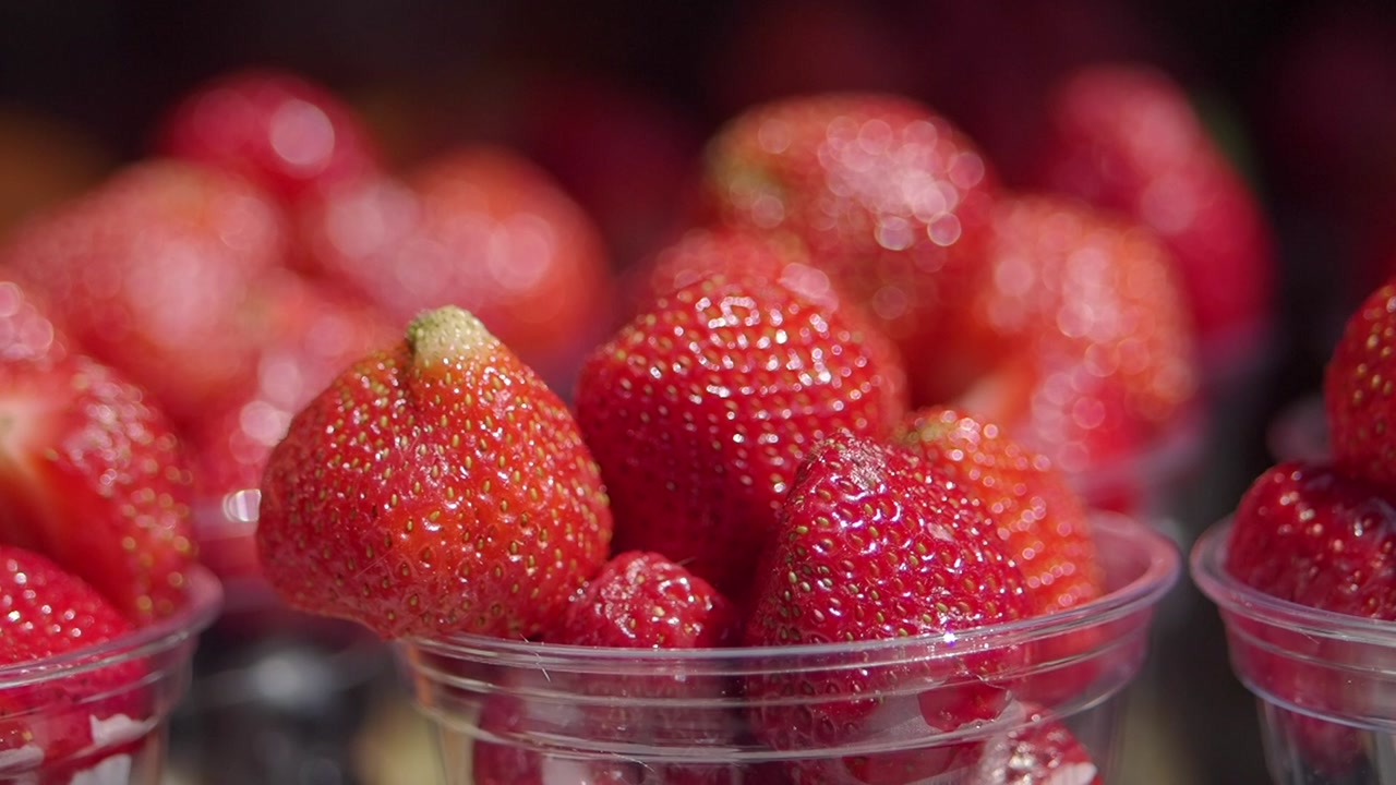 Close-up of Fresh Red Strawberries in Plastic Cups