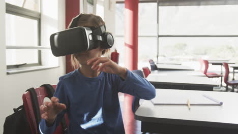 in school, african american girl using vr headset and headphones in classroom, exploring technology