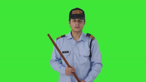 indian security guard listening to someone green screen