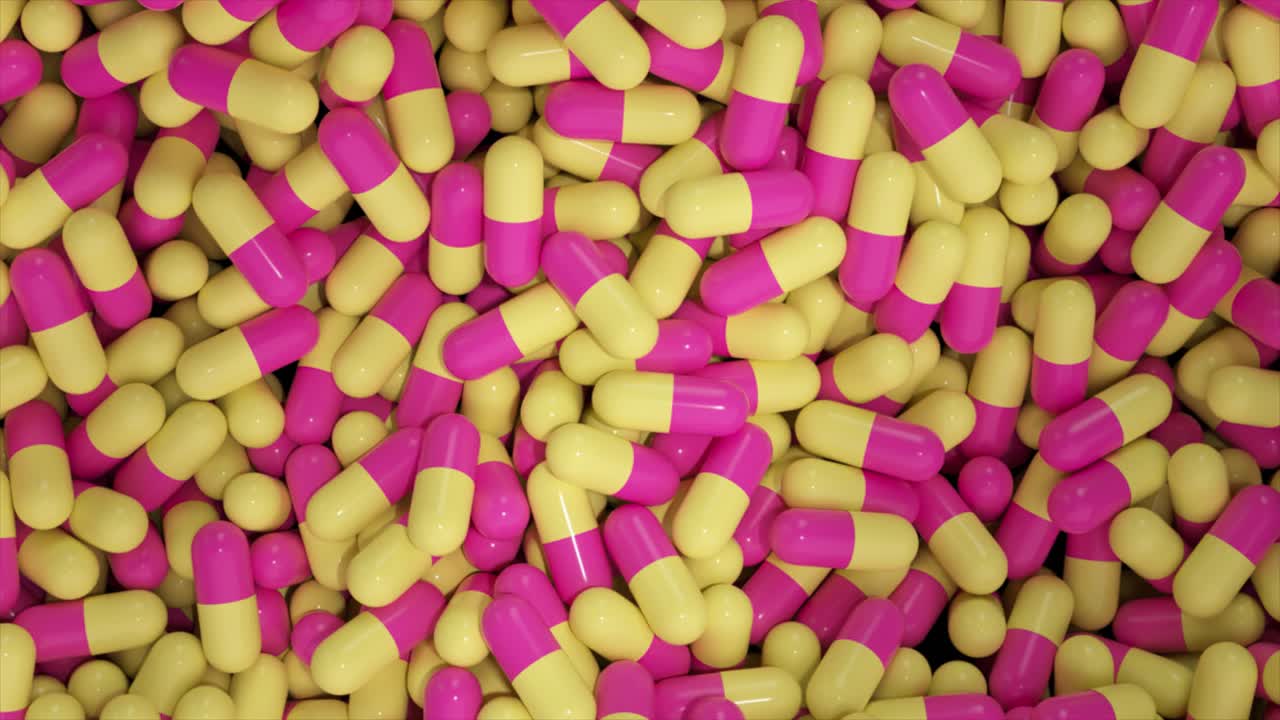 cápsulas rosadas y amarillas