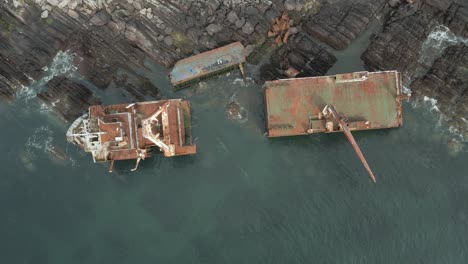 Overhead-View-Of-MV-Alta-Shipwreck-Split-in-Half-On-The-Rocky-Coast-Of-Ballycotton,-Ireland